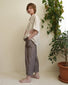 Pantalone alla caviglia con tasche asimmetriche e elastico in vita in lino marrone a righe
