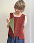 Gilet asimmetrico con tasca color mattone
